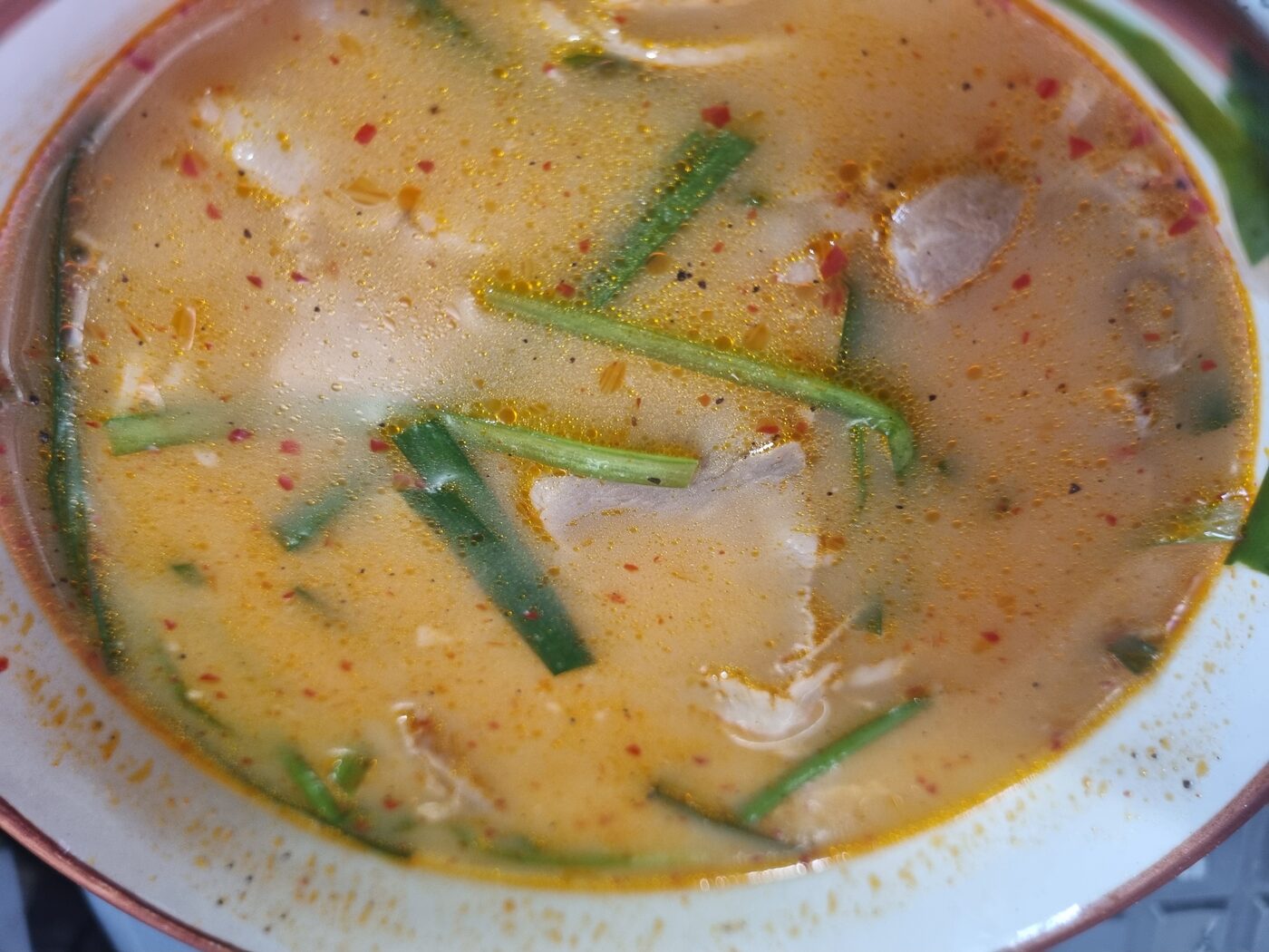 Korean dwaeji gukbap pork and rice soup topped with garlic chives at home