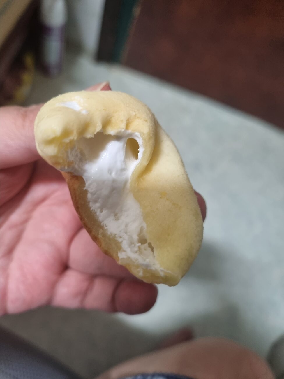 Seoul Milk kaymak mochi ball cut open showing cream filling