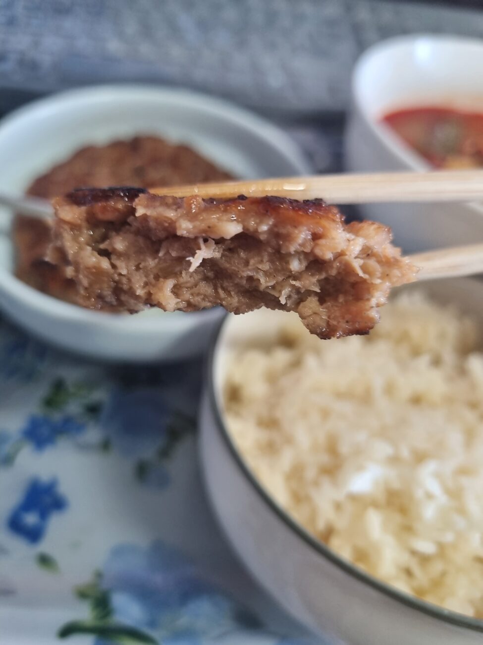 Grilled Korean tteokgalbi patty on a spoon