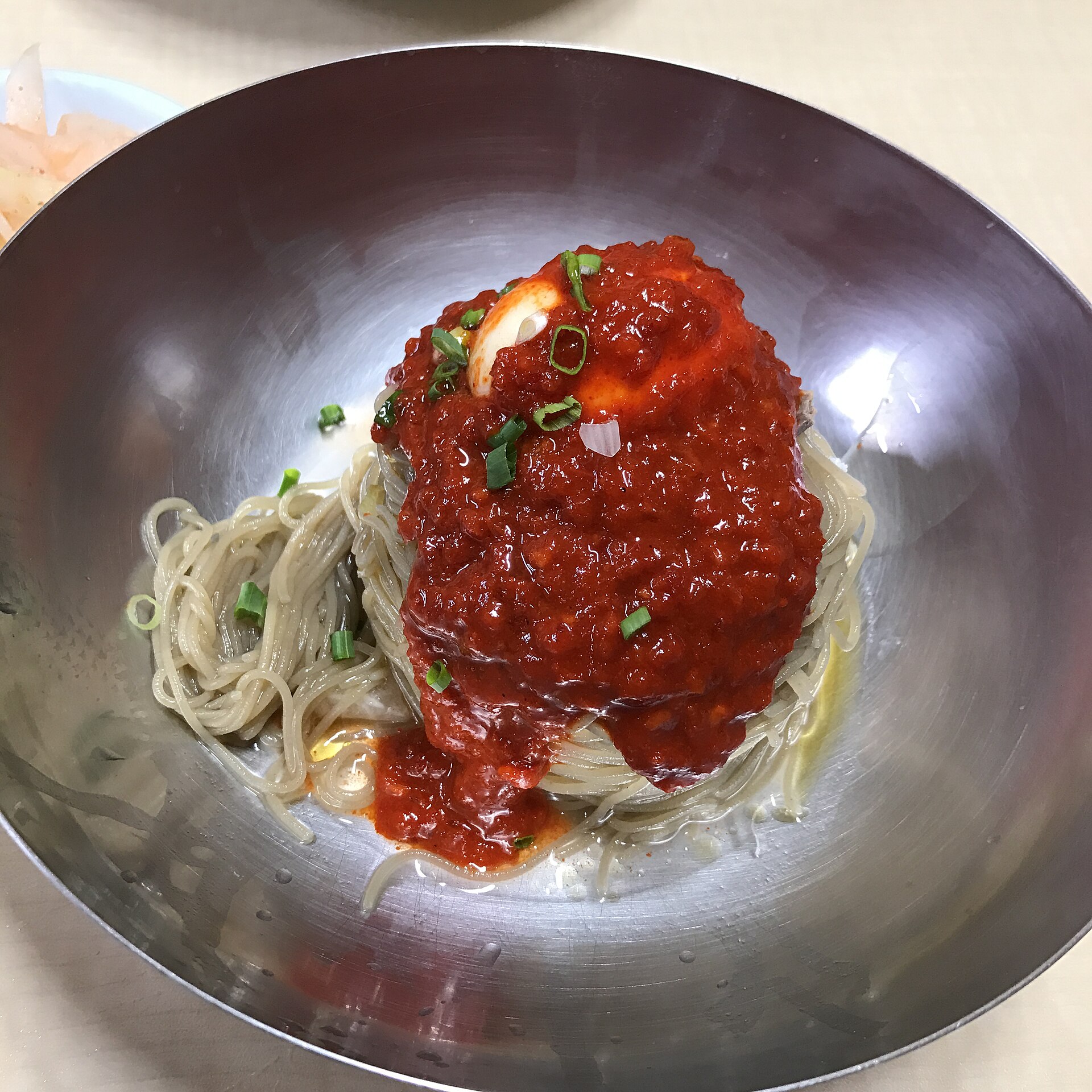 Cold buckwheat noodles mixed with red chilli sauce