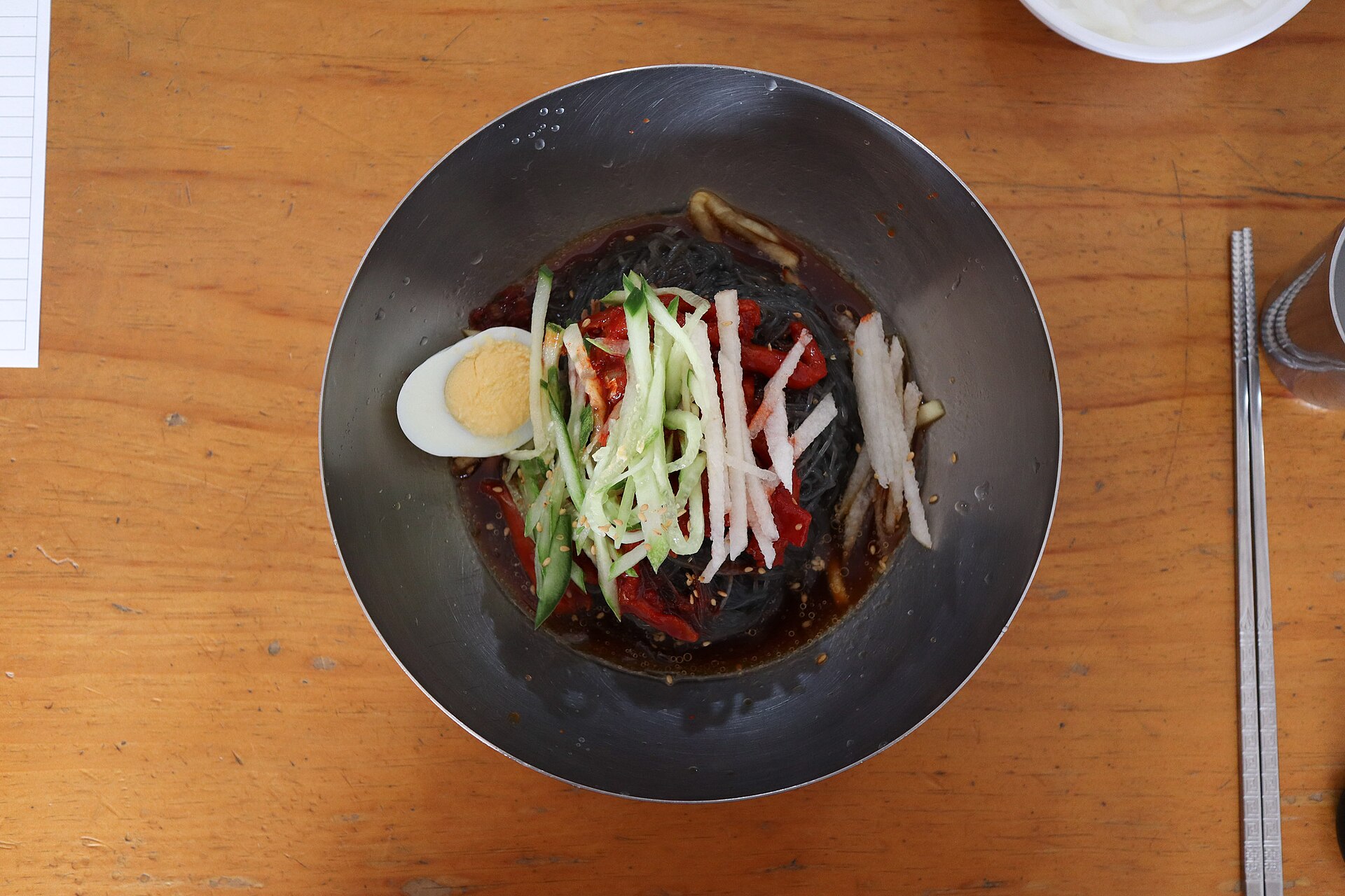 A bowl of Hamhung-style cold noodles with chilli dressing