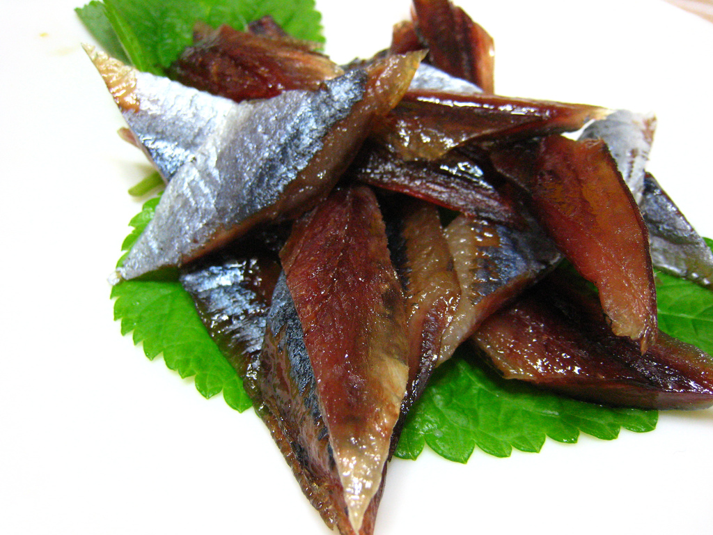 Half-dried fish served with vegetables and seaweed