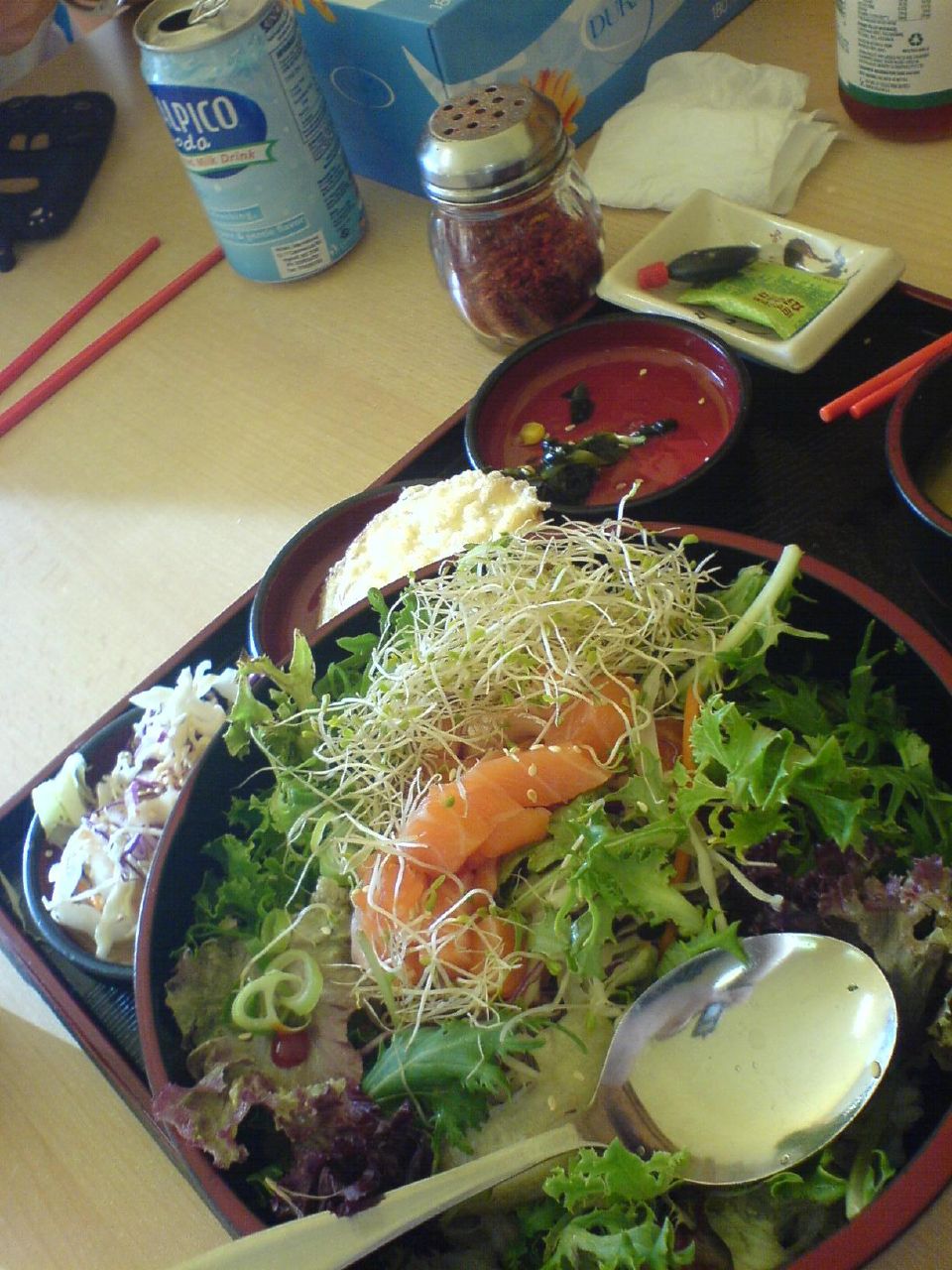 Raw fish and vegetables over rice