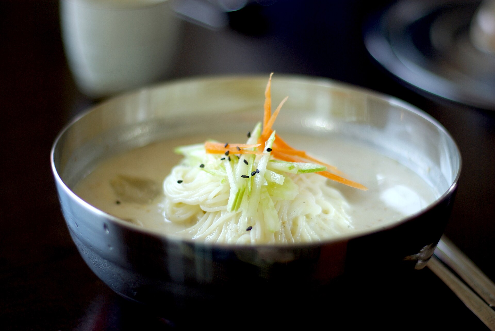 Noodles in a bowl of chilled soybean broth