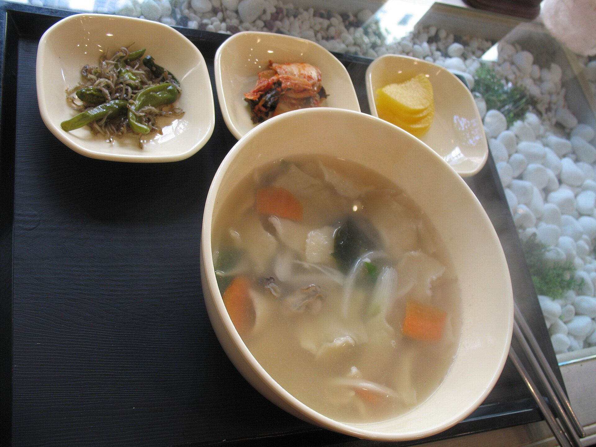 Hand-torn dough pieces in a light soup