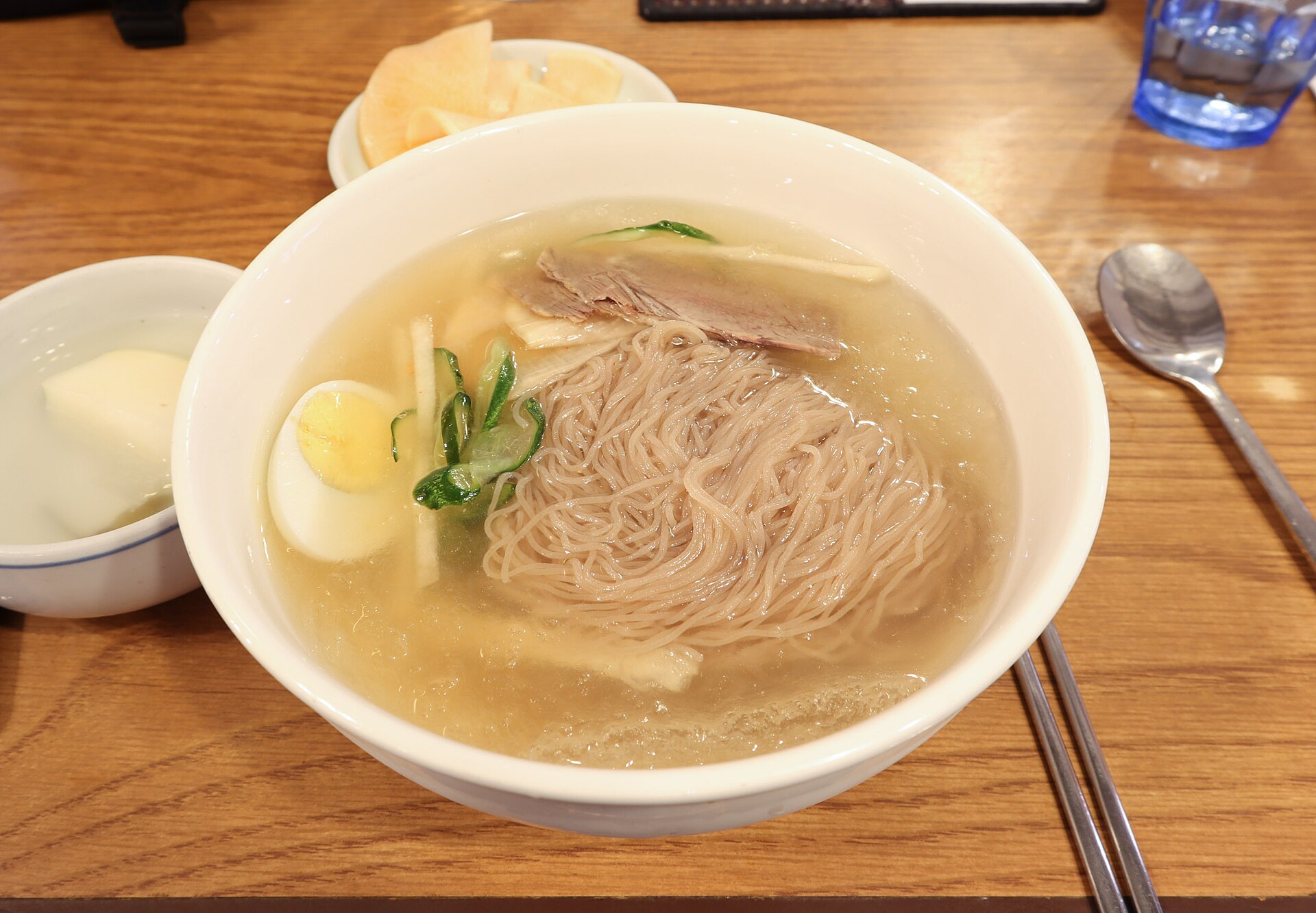 A pale bowl of Pyongyang-style cold buckwheat noodles